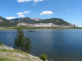 A spokesperson with Calgary EMS said crews were called to the area roughly 86 kilometres west of Calgary shortly after 1 p.m. on Sunday, May 19, 2018. The Lafarge cement plant in Exshaw, Alberta, across the waters of Lac des Arcs. Photo by Peter Brosseau/Calgary Herald