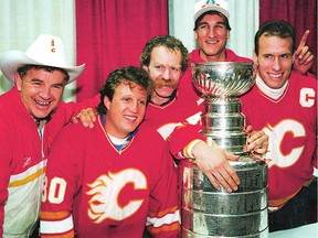 File photo-Calgary Flames Terry Crisp (Head Coach), Mike Vernon,Lanny McDonald, Tim Hunter and Jim Peplinski with the Stanley Cup-Calgary Sun/QMI Agency