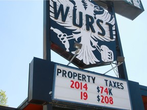 A sign for WURST restaurant in Calgary's Mission district shows the amount that the business' property taxes have gone up in recent years.Monday, May 27, 2019.