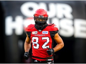 Juwan Brescacin of the Calgary Stampeders runs onto the field during player introductions before facing the BC Lions in CFL football on Saturday, October 13, 2018. Al Charest/Postmedia