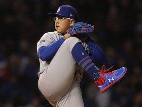 In this April 23, 2019, file photo, Los Angeles Dodgers' Julio Urias pitches against the Chicago Cubs during the first inning of a baseball game in Chicago. Los Angeles police say Urias was arrested Monday evening, May 13, 2019, for investigation of misdemeanor domestic battery. No details of the incident were released.