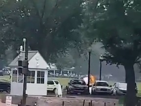 In this screengrab of a video posted on Twitter, person engulfed in flames is seen at a park near the White House Wednesday afternoon. (Twitter)