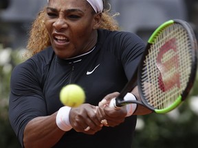 Serena Williams, of the United States, serves the ball to Sweden's Rebecca Peterson during their match at the Italian Open tennis tournament, in Rome, Monday, May, 13, 2019.