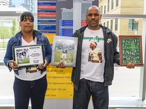 Renee Hill, left, and Reggie Hill, parents of Calgary Stampeder Mylan Hicks, pose for a photo at the Calgary Courts Centre on Thursday, May 30, 2019.