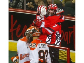 Calgary Roughnecks Tyler Burton celebrates a goal against Buffalo Bandits goalie, Matt Vinc in Game 2 of the 2019 NLL  Finals at the Scotiabank Saddledome  Calgary on Saturday, May 25, 2019. Darren Makowichuk/Postmedia