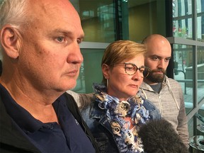 Jody and Brenda Wiese and stabbing victim Colton Lewis following a jury's guilty verdict in murder of Brett Wiese, Jody and Brenda's son. Kevin Martin/Postmedia Calgary