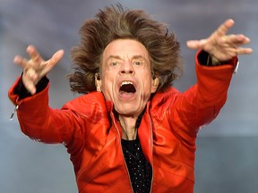 In this file photo taken on June 22, 2018, Rolling Stones singer Mick Jagger performs with the band during a concert at Berlin's Olympic Stadium on June 22, 2018.