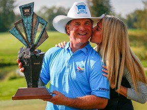 Scott McCarron poses with his wife Jenny after winning the 2018 Shaw Charity Classic in Calgary on Sept. 2, 2018.