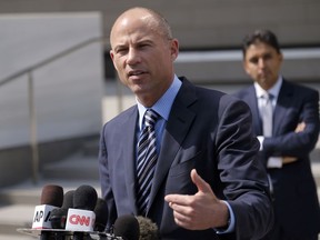 In this July 27, 2018 file photo, attorney Michael Avenatti replies to questions by reporters during a news conference in front of the U.S. Federal Courthouse in Los Angeles.