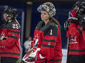 In this Nov. 10, 2018, file photo, Canada goaltender Shannon Szabados watch as U.S. players celebrate a win during the Four Nations Cup hockey gold-medal game in Saskatoon, Saskatchewan.