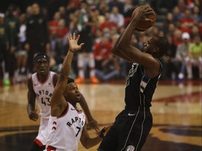 Milwaukee Bucks Khris Middleton SF (22) goes against Toronto Raptors Kyle Lowry PG (7) during the first half in Toronto, Ont. on Saturday May 25, 2019.