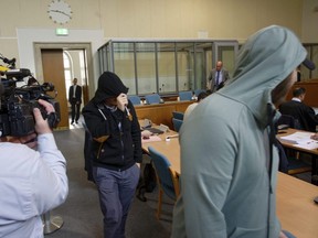 Two defendants of a self-styled 'Sharia police' arrive in a courtroom in Wuppertal, Germany, May 24, 2019.