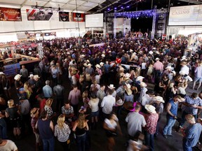 Known as the "World Stampede Headquarters", the Cowboys Tent at the Stampede is always packed with an average wait time of a couple hours to get in out side of the Stampede Grounds in Calgary, Alta. on Saturday July 5, 2014. Hugo Yuen/Special to the Calgary Sun/QMI Agency
