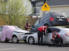 Police investigate the scene of an early morning homicide in Calgary's Taradale neighbourhood on Wednesday May 15, 2019. Gavin Young/Postmedia