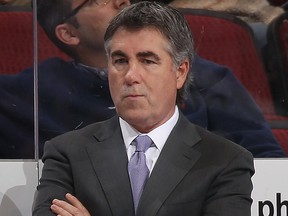 In this December 21, 2016 file photo, then-head coach Dave Tippett of the Arizona Coyotes watches from the bench during the third period of the NHL game against the Edmonton Oilers at Gila River Arena in Glendale, Ariz.