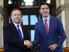 Prime Minister Justin Trudeau shakes hands with Alberta Premier Jason Kenney in his office on Parliament Hill in Ottawa on Thursday, May 2, 2019.