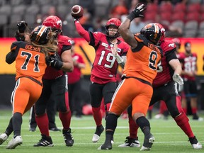 Calgary Stampeders quarterback Bo Levi Mitchell (19) passes against the B.C. Lions during the first half of a pre-season CFL football game in Vancouver on Friday. Photo by Darryl Dyck/The Canadian Press.