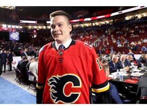 VANCOUVER, BRITISH COLUMBIA - JUNE 22: Ilya Nikolaev reacts after being selected 88th overall by the Calgary Flames during the 2019 NHL Draft at Rogers Arena on June 22, 2019 in Vancouver, Canada.