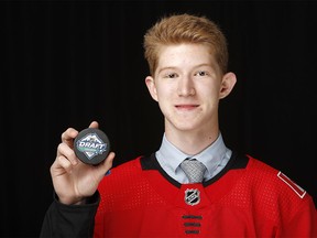 VANCOUVER, BRITISH COLUMBIA - JUNE 22: Dustin Wolf poses after being selected 214th overall by the Calgary Flames during the 2019 NHL Draft at Rogers Arena on June 22, 2019 in Vancouver, Canada. (Photo by Kevin Light/Getty Images)