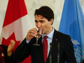 Justin Trudeau, Prime Minister of Canada takes a drink of water while he speaks at the United Nations in New York on March 16, 2016.