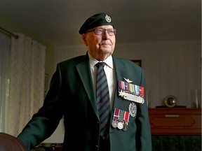 George Couture, a D Day veteran, poses in his southwest Calgary home on Thursday, May 30, 2019. Couture, was with the Royal Winnipeg Rifles in Normandy during the invasion. He was taken prisoner three days later then rescued from a POW camp after 11 months.