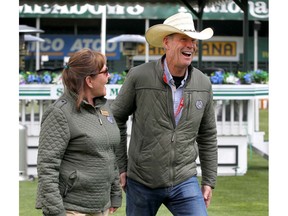 Ian Millar (R) shares a laugh with Linda Southern-Heathcott during trophy presentations during the Friends of the Meadows Cup at Spruce Meadows in Calgary on Wednesday, June 5, 2019. The National showjumping competition continues through Sunday. Millar competed in ten Olympic Games and recently retired from competition after 40-plus years of showjumping.Jim Wells/Postmedia
