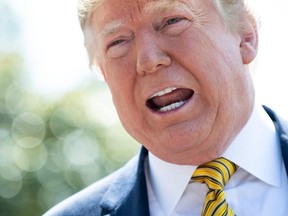 US President Donald Trump speaks to the media prior to departing on Marine One from the South Lawn of the White House in Washington, DC, June 22, 2019, as he travels to Camp David, Maryland.