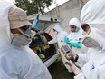 Emergency personnel wearing protective suits check the air quality in Pasir Gudang on June 25, 2019, after toxic fumes were reported in the area. (MUHAMMAD SYUKRI/AFP/Getty Images)