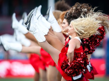 The Calgary Stampeders Outriders (cheerleaders) hit the field ball before a game against the Ottawa Redblacks during CFL football in Calgary on Saturday, June 15, 2019. Al Charest/Postmedia