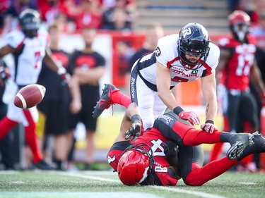 Calgary Stampeders Eric Rogers is unable to make the catch in front of Antoine Pruneau of the Ottawa Redblacks during CFL football in Calgary on Saturday, June 15, 2019. Al Charest/Postmedia