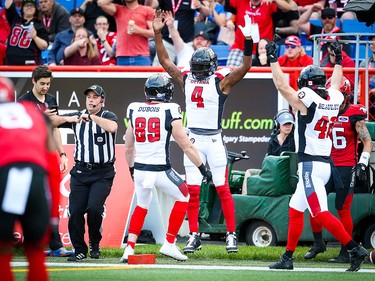 Ottawa Redblacks quarterback Dominique Davis celebrates after his game winning touchdown against the Calgary Stampeders during CFL football in Calgary on Saturday, June 15, 2019. Al Charest/Postmedia