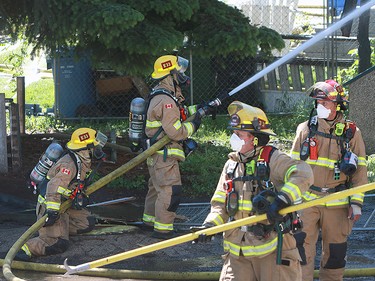 Calgary Fire crews were on scene at a fire in an abandoned home at 2500 16 Street SW in Bankview Friday, June 28, 2019. Dean Pilling/Postmedia