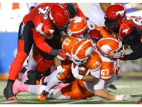 BC Lions Tyrell Sutton runs the ball against the Calgary Stampeders during CFL football in Calgary on Saturday, October 13, 2018. Al Charest/Postmedia