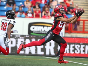 Stampeders' Juwan Brescacin stretches for a long TD pass from Bo Levi Mitchell in the first quarter during CFL action between the Ottawa Redblacks and the Calgary Stampeders in Calgary on Saturday, June 15, 2019. Jim Wells/Postmedia
