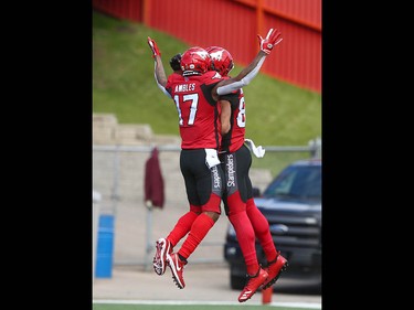 Stampeders Markeith Ambles (L)and Juwan Brescacin celebrate Brescacin's first quarter TD during CFL action between the Ottawa Redblacks and the Calgary Stampeders in Calgary on Saturday, June 15, 2019. Jim Wells/Postmedia