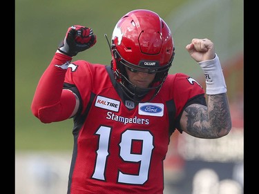 Stamps QB Bo Levi Mitchell celebrates Don Jackson's TD in the first quarter during CFL action between the Ottawa Redblacks and the Calgary Stampeders in Calgary on Saturday, June 15, 2019. Jim Wells/Postmedia