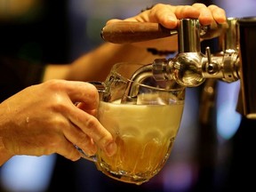 A bartender pours a glass of beer inside of a new conceptual pub by Plzensky Prazdroj (Pilsner Urquell) brewery called Plzenka in Prague, Czech Republic, May 6, 2019. Picture taken May 6, 2019. REUTERS/David W Cerny ORG XMIT: HFS-DWC04