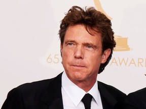 Producer John de Mol of NBC's reality series "The Voice" poses backstage with his award for Outstanding Reality Program at the 65th Primetime Emmy Awards in Los Angeles September 22, 2013.