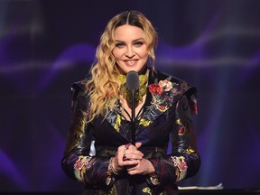 Madonna speaks on stage at the Billboard Women in Music 2016 event on December 9, 2016 in New York City.