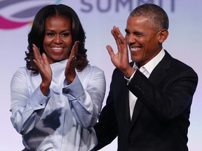 Former US President Barack Obama and his wife Michelle arrive at the Obama Foundation Summit in Chicago, Illinois, October 31, 2017.