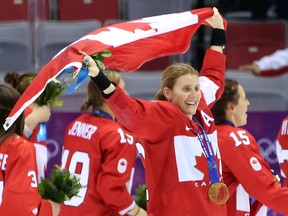 Hayley Wickenheiser celebrates after defeating the U.S. in overtime at the 2014 Winter Olympics in Sochi.