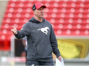Stampeders head coach Dave Dickenson instructs players during the first session of Calgary Stampeders CFL training camp in Calgary Sunday, May 19, 2019. Jim Wells/Postmedia ders