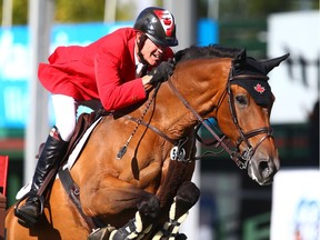 Ian Millar, from Canada, rides Dixson, in the Nations' Cup during the Masters at Spruce Meadows in Calgary on Saturday, September 8, 2018. Germany won the Nations' Cup and Canada finished second. Jim Wells/Postmedia