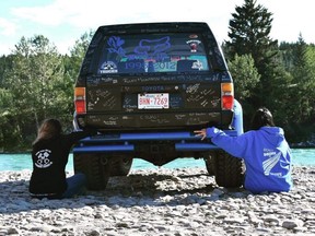 Kayla Thomas (left) and Kim Thomas, the sister and mother of Cochrane teen Brandon Thomas, sit beside his truck, which became a memorial to the 17-year-old after he was killed by a drunk driver in 2012. The truck was briefly stolen on Monday, June 3, 2019 but was found thanks to supporters. Supplied photo/Postmedia Calgary