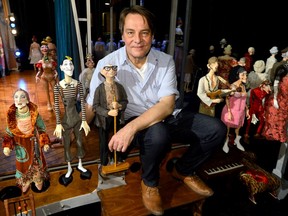 Master puppeteer Ronnie Burkett with sits surrounded by his puppets a the McManus Theatre in London, Ontario on Monday Nov 7, 2016.