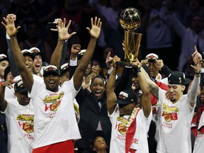 The Toronto Raptors celebrates with the Larry O'Brien Championship Trophy after they defeated the Golden State Warriors last night at Oracle Arena. (Getty Images)