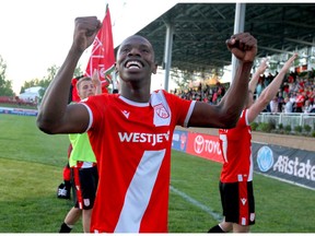 Cavalry FC's Elijah Adekugbe celebrates post game after CPL Action between the Hamilton Forge FC and Cavalry FC in Calgary at ATCO Field at Spruce Meadows on Tuesday. Cavalry won 2-1. Photo by Jim Wells/Postmedia.