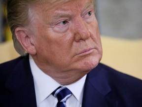 U.S. President Donald Trump listens to questions from reporters during a meeting with Canada's Prime Minister Justin Trudeau in the Oval Office of the White House in Washington, U.S., June 20, 2019. (REUTERS/Jonathan Ernst)