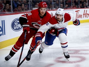 MONTREAL, QUE.: DECEMBER 13, 2018-- Montreal Canadiens center Phillip Danault and Carolina Hurricanes center Sebastian Aho during NHL action in Montreal on Thursday December 13, 2018. (Allen McInnis / MONTREAL GAZETTE) ORG XMIT: 61867