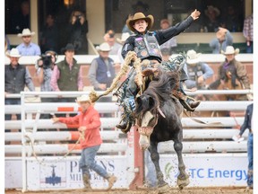 Zeke Thurston from Big Valley, AB rides Peigan Warrior during the Saddle Bronc Performance competition and wins the first place in 2019 Calgary Stampede Friday, July 5, 2019. Azin Ghaffari/Postmedia Calgary Friday, July 5, 2019. Azin Ghaffari/Postmedia Calgary